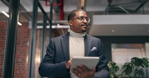 Tablet, thinking and walking with business man in office corridor for planning Stock Footage 340819822