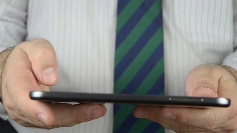 Tablet used by a businessman Stock Footage 84891381