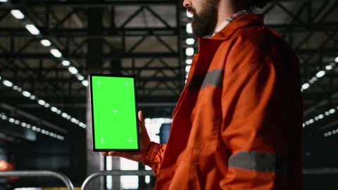 Tablet, vertical green screen, male engineer, heavy industry operations Stock Footage 330087910