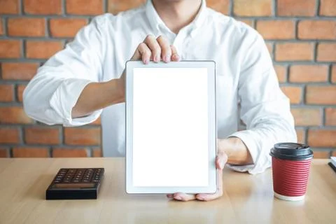 Tablet vertical screen mockup, Image of Young man holding digital tablet show Stock Photos