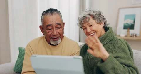Tablet, wave and video call with old couple on sofa for communication, streaming Stock Footage 247256270