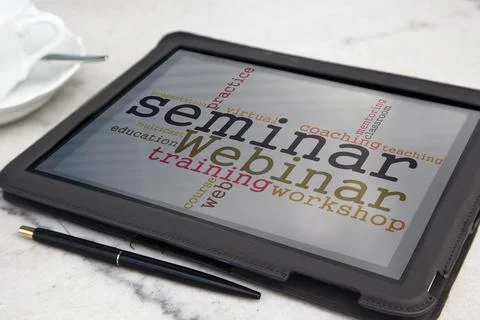 Tablet with webinar word cloud Stock Photos