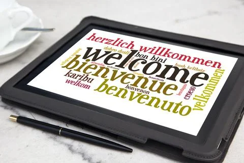 Tablet with welcome word cloud Stock Photos