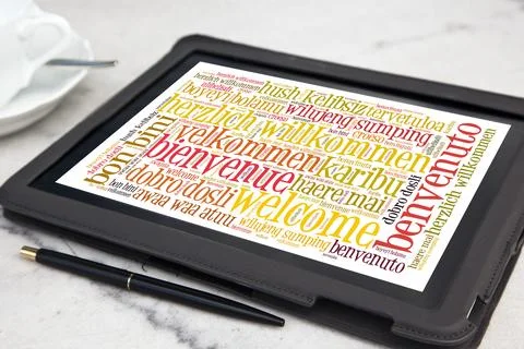 Tablet with welcome word cloud Stock Photos