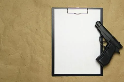 A tablet with a white sheet of A4 format on a beige craft paper. Stock Photos