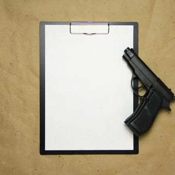 A tablet with a white sheet of A4 format on a beige craft paper. Stock Photos