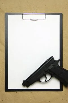 A tablet with a white sheet of A4 format on a beige craft paper. Stock Photos