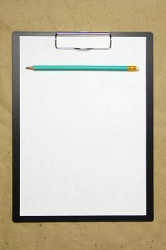 A tablet with a white sheet of A4 format on a beige craft paper. Foto stock