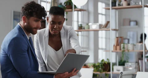 Tablet, window and business people in office with discussion for review on Stock Footage 336596489