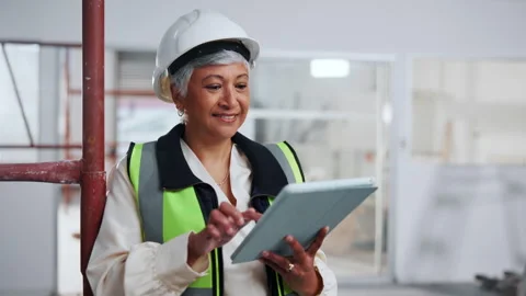 Tablet, woman and construction worker on site with planning for remodeling Stock Footage 341546821