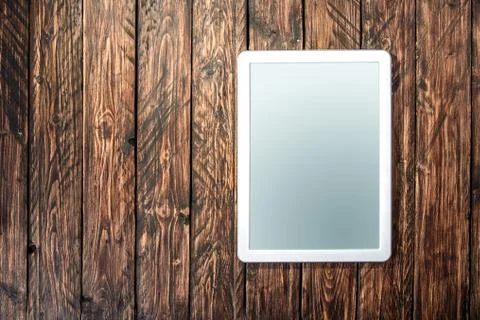 Tablet on a wooden background Stock Photos