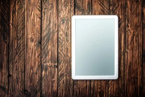 Tablet on a wooden background Stock Photos