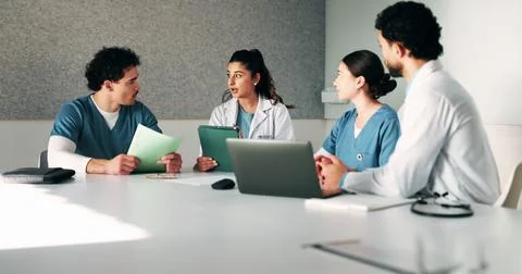 Tablet, workshop and discussion with doctors in office for talking, surgery.. Stock Photos