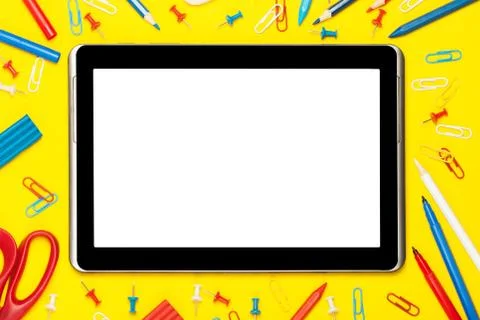 Tablet on a yellow background Stock Photos