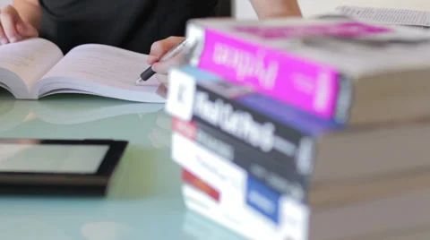 Tablet -  young male in thoughts doing an exam Stock Footage 32355039