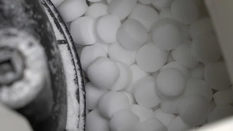 Tableted salt drops into softener water. Close-up. Video stock 100903225