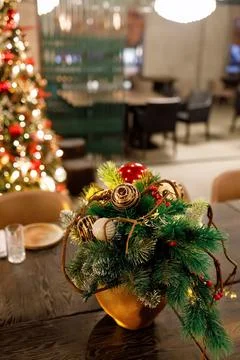 Tabletop composition of branches of a Christmas tree, yellow and red Christma Stock Photos