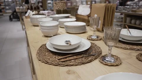 Tabletop display with elegant dinnerware and glasses in store Stock Footage 320639297