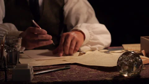 Tabletop - Early 20th Century Man writing letters in a busy office Stock Footage 203835802