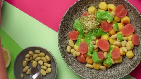 Tabletop food video recipes: chef adds micro greens to the vegetarian meal, 4k Stock Footage 213964849