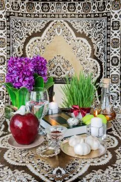 Tabletop with Haft-seen elements for Nowruz Stock Photos