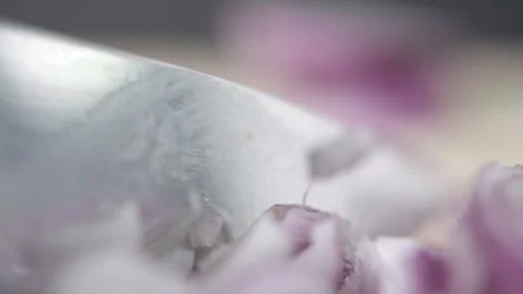 Tabletop Macro Close up of kitchen knife chopping onions in slow motion Stock Footage 273424746