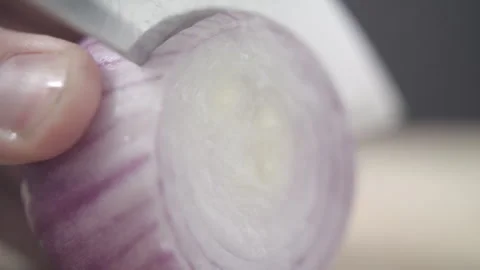 Tabletop Macro Close up of kitchen knife chopping onions in slow motion Stock Footage 273426751