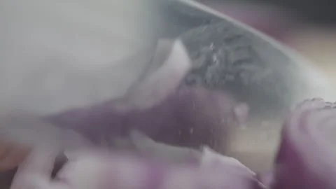 Tabletop Macro Close up of kitchen knife chopping onions in slow motion Stock Footage 273426924