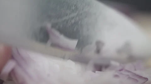 Tabletop Macro Close up of kitchen knife chopping onions in slow motion Stock Footage 273428029