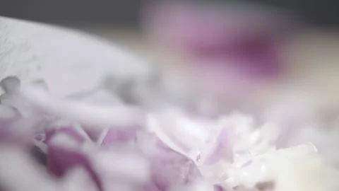 Tabletop Macro Close up of kitchen knife chopping onions in slow motion Stock Footage 273428056
