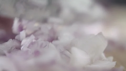 Tabletop Macro Close up of kitchen knife chopping onions in slow motion Stock Footage 273428707
