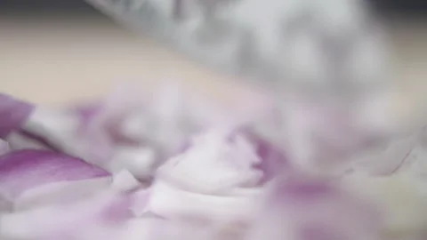 Tabletop Macro Close up of kitchen knife chopping onions in slow motion Stock Footage 273428938