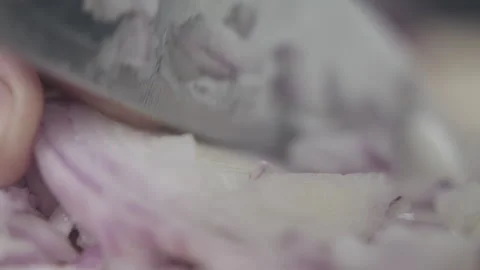 Tabletop Macro Close up of kitchen knife chopping onions in slow motion Stock Footage 273429017