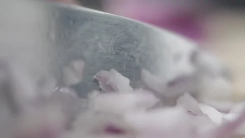 Tabletop Macro Close up of kitchen knife chopping onions in slow motion Stock Footage 273429458