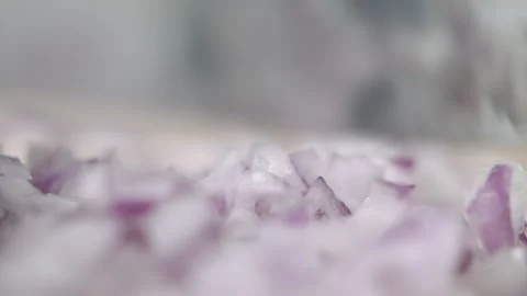 Tabletop Macro Close up of kitchen knife chopping onions in slow motion Stock Footage 273429579
