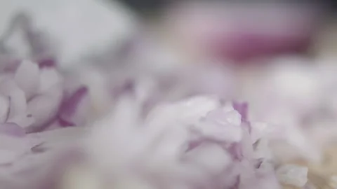 Tabletop Macro Close up of kitchen knife chopping onions in slow motion Stock Footage 273430004