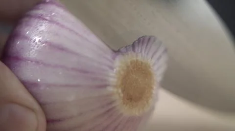 Tabletop Macro Close up of kitchen knife chopping onions in slow motion Stock Photos