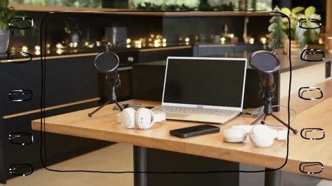 Tabletop studio setup featuring laptop, mics, camera panning while film-strip Video stock 330672897