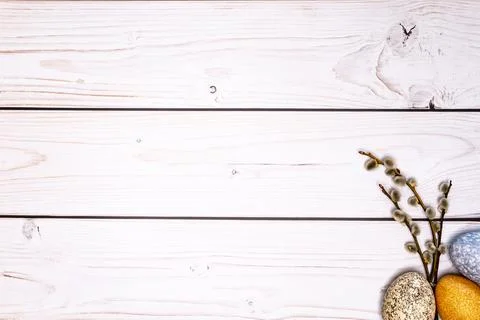 Tabletop with subtly colored Easter eggs and willow catkins Stock Photos
