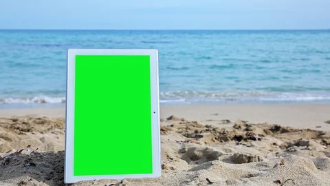 TabletPC with green screen on the beach 2 Stock Footage 126960664