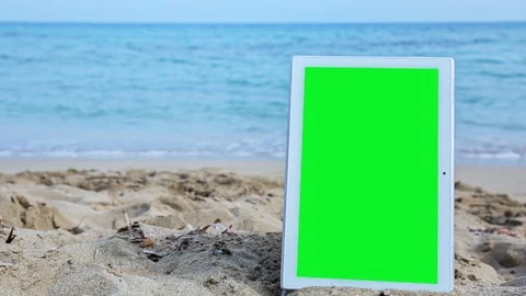 TabletPC with green screen on the beach 3 Stock Footage 126963603