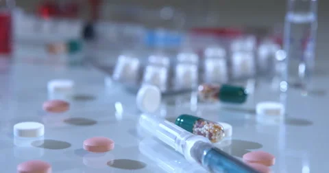 Tablets Ampoules Syringes on table Stock-Footage 55910651