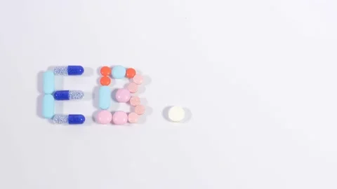Tablets and capsules make word ebola Stock Footage 236285644