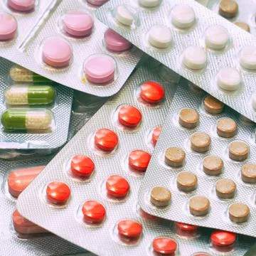 Tablets and capsules Packed in blisters. Pharmaceutical or medical background Stock Photos