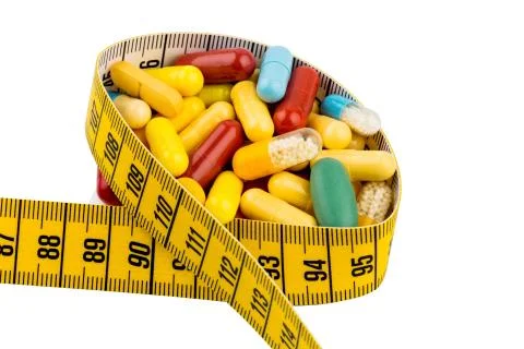 Tablets and measuring tape Stock Photos