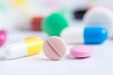 Tablets and pills on a white background Stock Photos