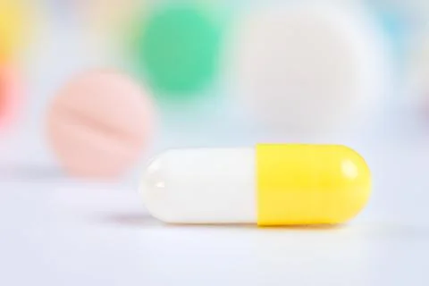 Tablets and pills on a white background Stock Photos