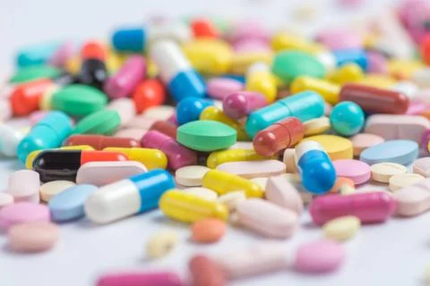 Tablets and pills on a white background Stock Photos