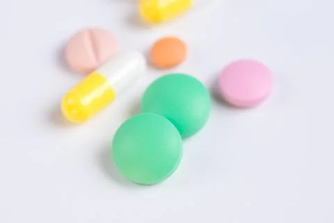 Tablets and pills on a white background Stock Photos