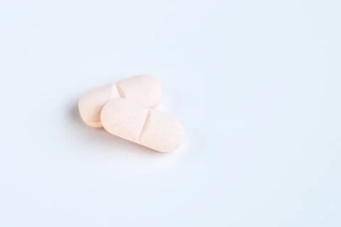 Tablets and pills on a white background Stock Photos